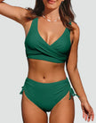 FJØRNA women's high waist bikini set with v-neck top, sporty fit, and matching bikini bottoms on a model outdoors.