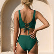 FJØRNA fitted wrap front bikini with wide straps, shown from the back, featuring a sleek design and supportive fit.