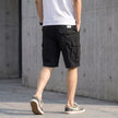 Men's FJØRNA casual cargo shorts showing back stitch detail and relaxed fit, with pockets and stitching visible from the rear view.