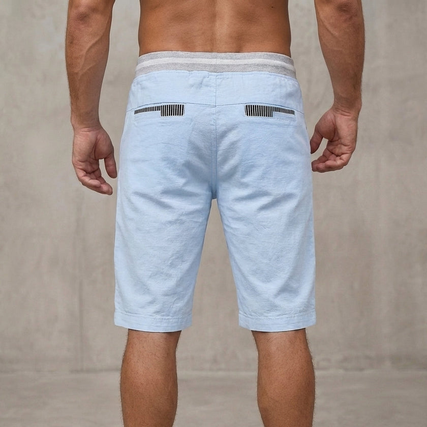 Back view of men's relaxed-fit work shorts by FJØRNA, showing tailored design and casual fit from the rear perspective.