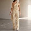 FJØRNA women's summer two-piece co-ord set with pockets and one-shoulder design, shown from the back with stylish details.