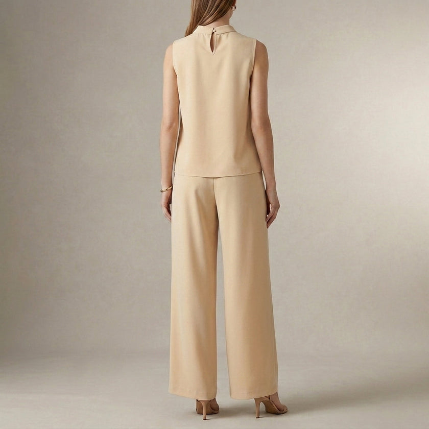 Back view of FJØRNA elegant two-piece women's co-ord set featuring a high waist and high neck design.