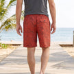 Men's FJØRNA tropical leaf pattern loose-fit knee-length beach shorts with back pockets, showing the stylish back detail.