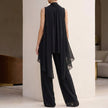 Back view of FJØRNA elegant two-piece chiffon pleated women's co-ord set, showcasing the flowing fabric and pleated design.