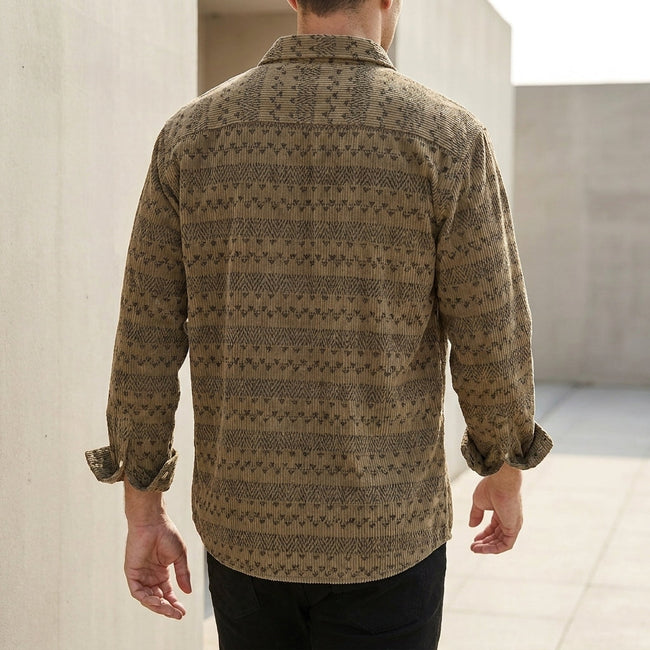 Men's relaxed button-front shirt with geometric pattern by FJØRNA, shown from the back. Comfortable and stylish men's top.