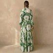 Back view of FJØRNA tiered maxi dress with tie-waist and ruffled details, perfect for special occasions.