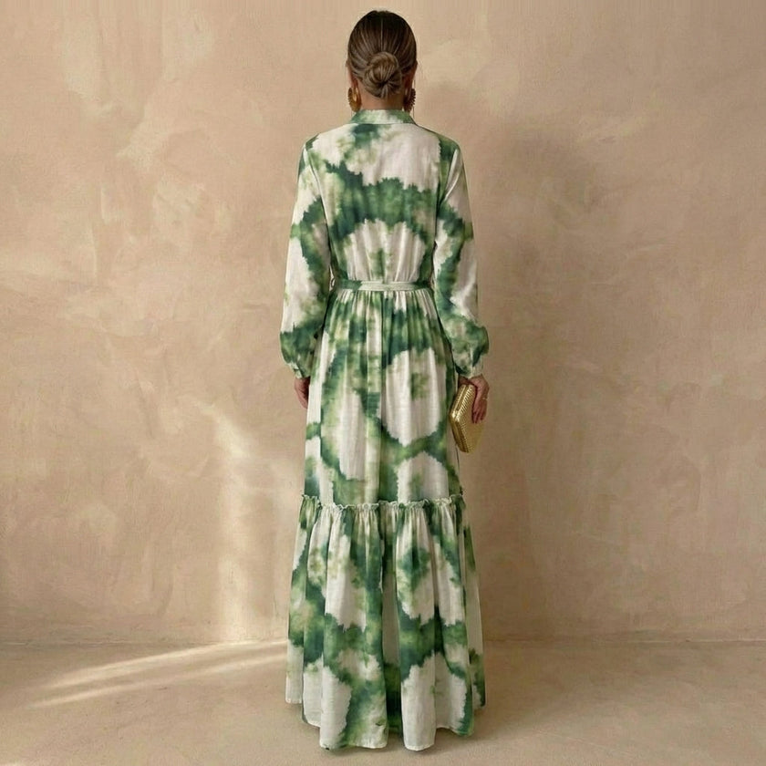 Back view of FJØRNA tiered maxi dress with tie-waist and ruffled details, perfect for special occasions.