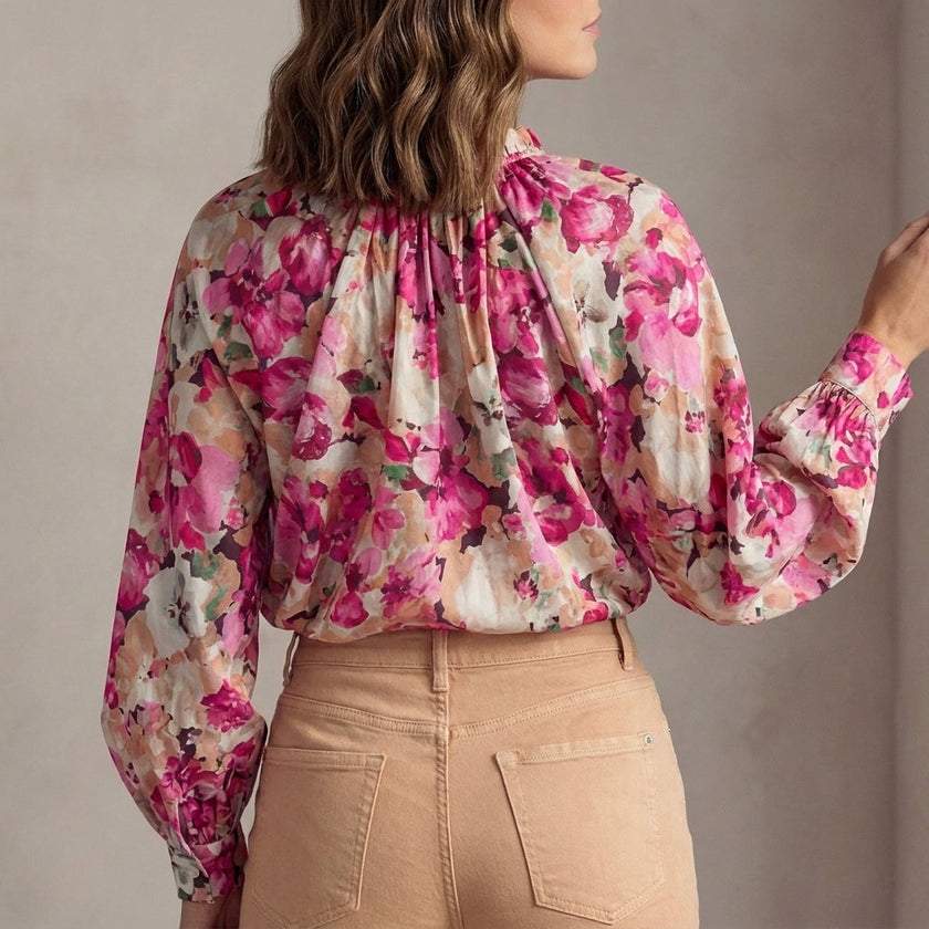 FJØRNA women's floral long sleeve summer blouse with ruffles, back view showcasing feminine design and lightweight fabric.