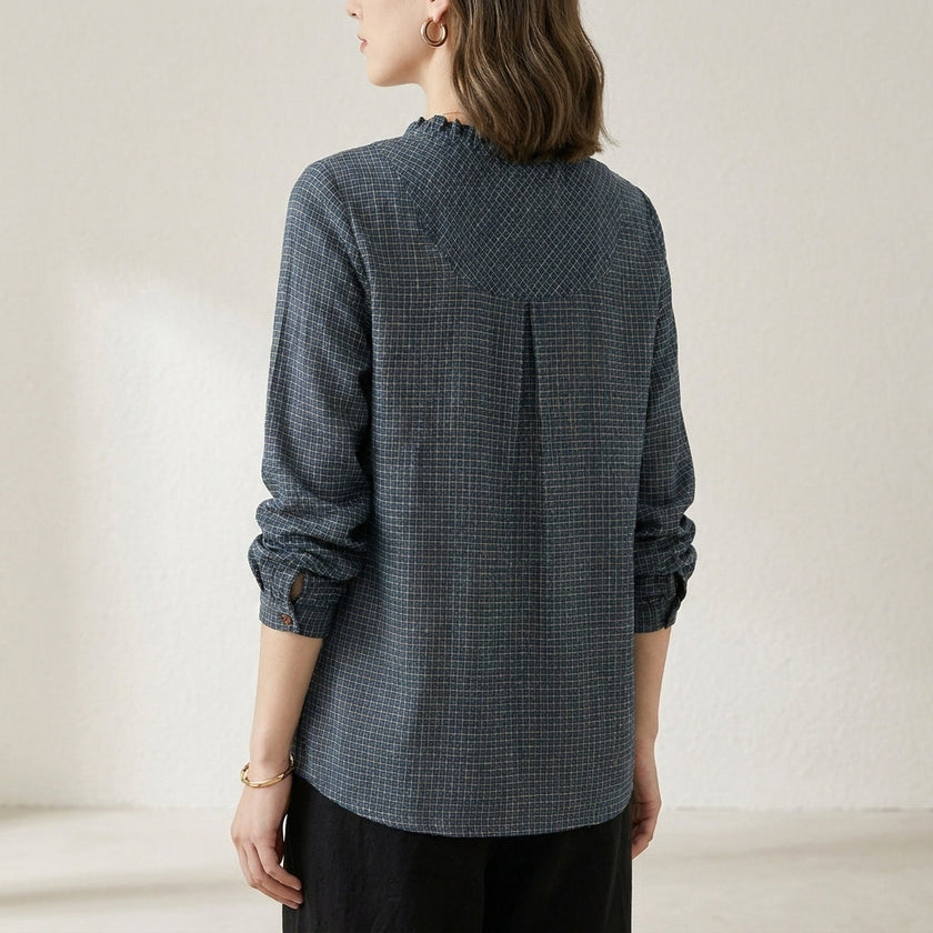 FJØRNA women's summer blouse with geometric pattern, long sleeves, shown from the back with a relaxed fit and stylish design.