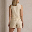 FJØRNA women's two-piece co-ord set with button-front top and matching pants, shown from the back.