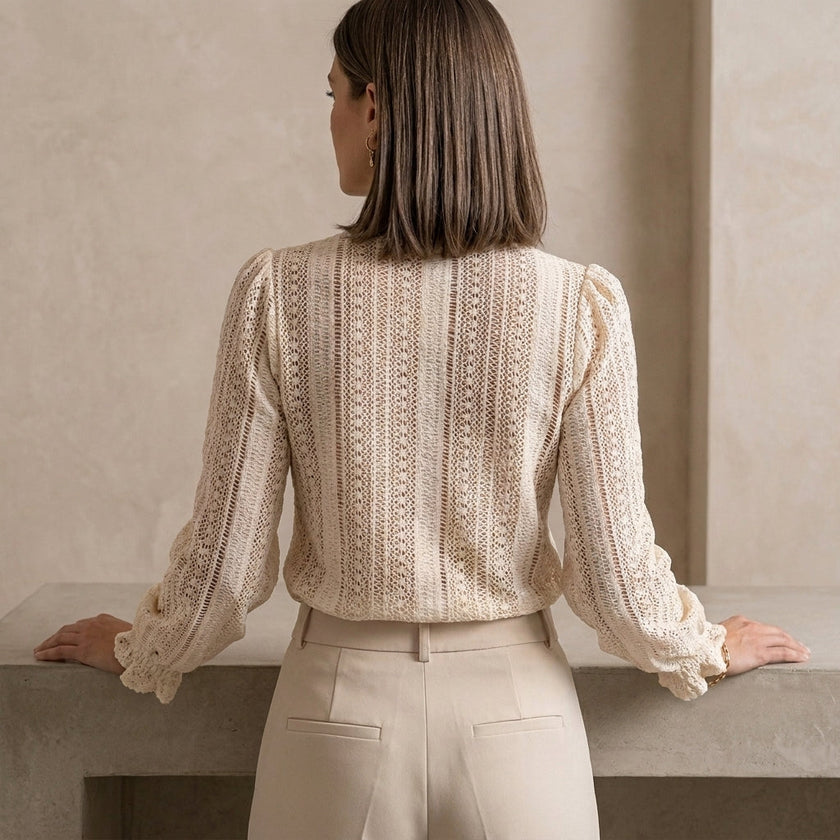 FJØRNA women's summer blouse with V-neck, long sleeves, and lace detailing, shown from the back.