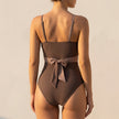 FJØRNA women's summer one-piece swimsuit with V-neck wrap, back view showing stylish design and fitted silhouette.