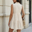 FJØRNA women's sleeveless tiered summer blouse shown from the back, lightweight and stylish for warm weather.