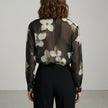 FJØRNA summer floral blouse for women with long sleeves, shown from the back, lightweight and stylish for warm weather.