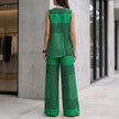 FJØRNA loose sleeveless top with asymmetrical hem paired with wide-leg pants in a stylish 2-piece set, viewed from the back.