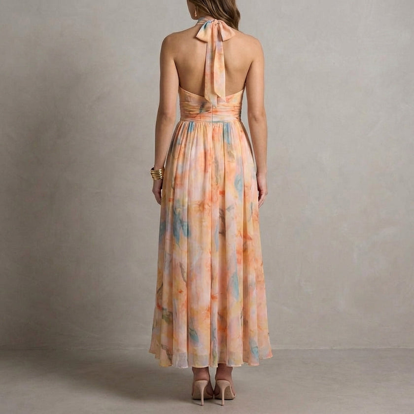 FJØRNA Ariellea flowing chiffon halter neck maxi dress with waist tie, shown from the back, elegant and lightweight for summer wear.