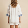 FJØRNA summer two-piece women's co-ord set with geometric pockets, shown from the back in lightweight fabric, stylish and comfortable.