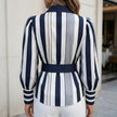 FJØRNA women's striped summer blouse with puff sleeves, shown from the back, lightweight and stylish top for warm weather.