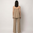 FJØRNA relaxed coastal camisole and wide-leg pants set shown from the back, featuring lightweight fabric and casual fit.