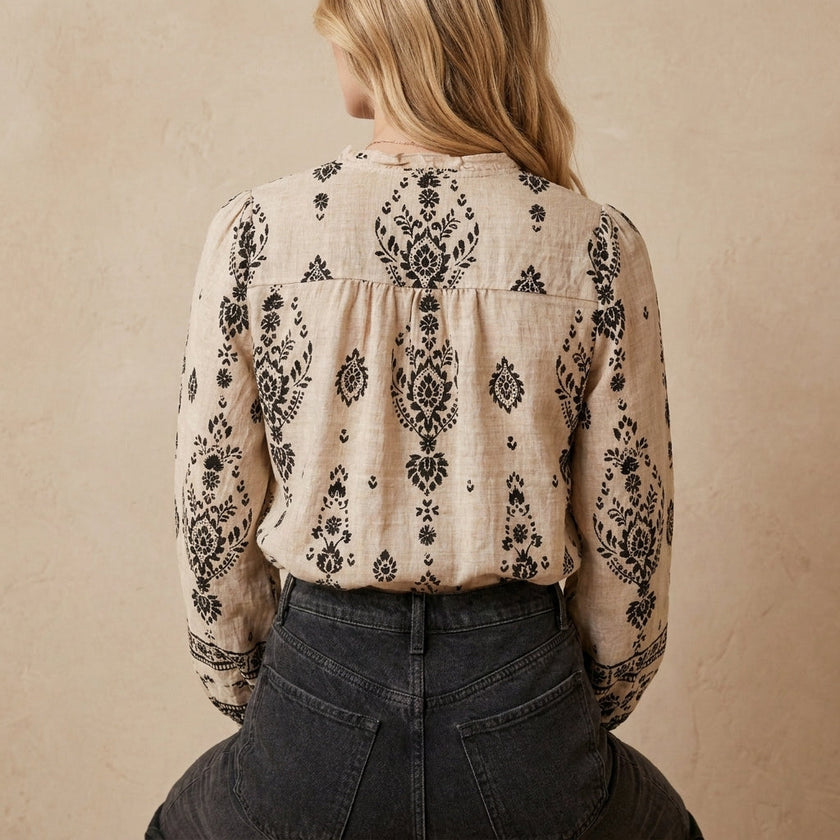 FJØRNA women's summer blouse with print and V-neck, showing the back view of the stylish, lightweight top.