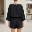 FJØRNA two-piece set with eyelet lace trim, relaxed silhouette, and back view showcasing comfortable, stylish casual outfit.