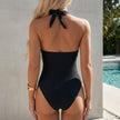FJØRNA women's floral halter neck one-piece swimsuit with bodycon fit, shown from the back in this summer swimwear photo.