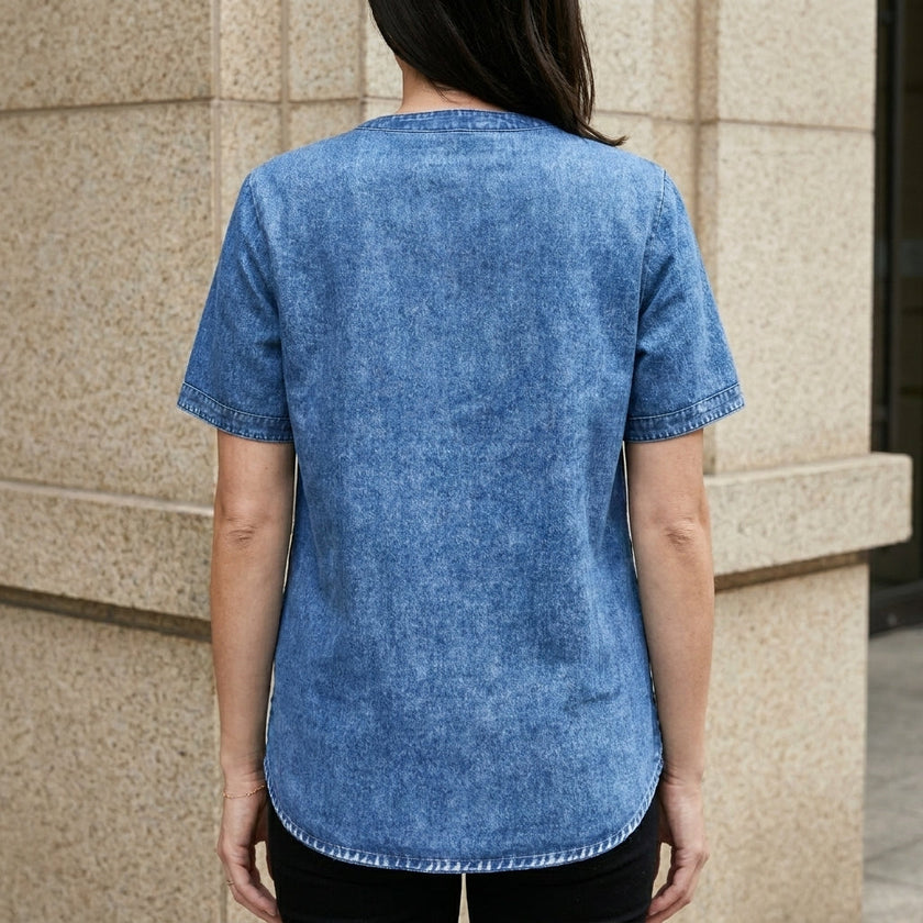 FJØRNA women's denim summer top with button-front design, shown from the back, casual and stylish for warm weather.