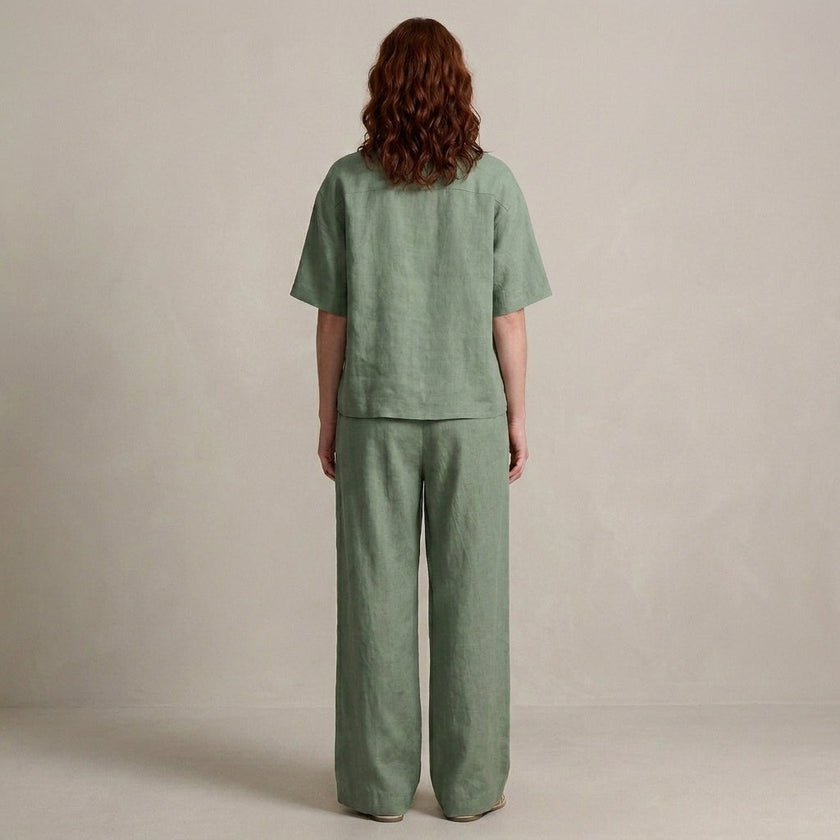FJØRNA zip-neck top and wide-leg trouser set, back view showcasing the sleek design and comfortable fit of the 2-piece outfit.