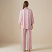FJØRNA relaxed blazer and wide-leg trouser set shown from the back, featuring tailored fit and modern style in a 2-piece ensemble.
