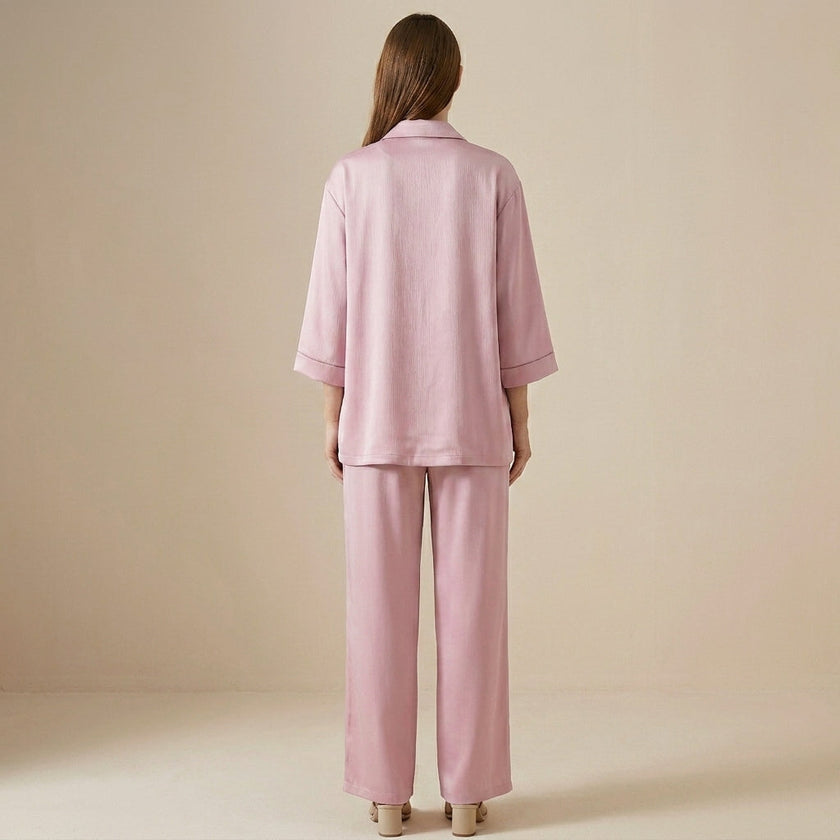 FJØRNA relaxed blazer and wide-leg trouser set shown from the back, featuring tailored fit and modern style in a 2-piece ensemble.