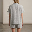 FJØRNA textured vertical stripe relaxed two-piece shirt and drawstring shorts set, back view showing casual fit and fabric details.