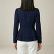Back view of FJØRNA women's summer blouse with V-neck, long sleeves, and denim wrap design, stylish and comfortable women's top.