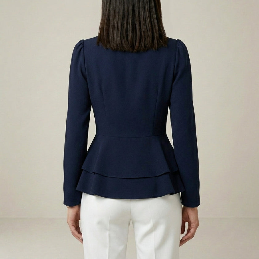 Back view of FJØRNA women's summer blouse with V-neck, long sleeves, and denim wrap design, stylish and comfortable women's top.