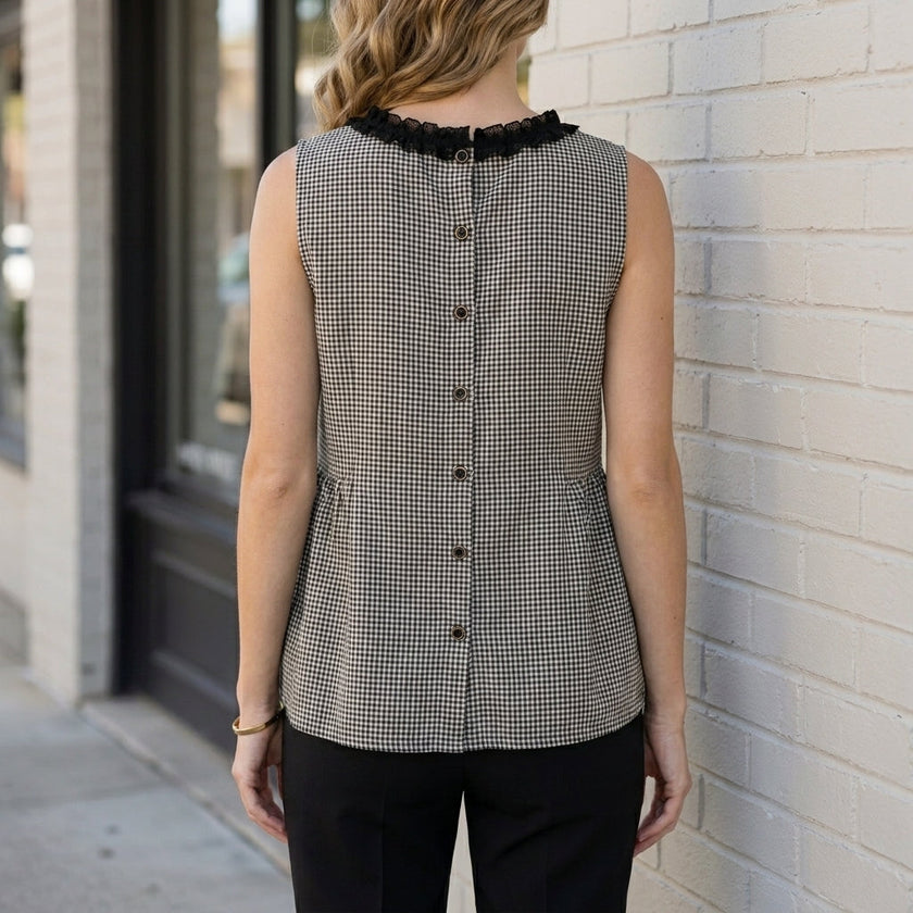 Back view of a women's sleeveless gingham summer blouse by FJØRNA, showcasing a relaxed fit and classic pattern.