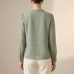 FJØRNA women's floral V-neck long sleeve summer blouse, back view showing lightweight fabric and vibrant floral pattern.