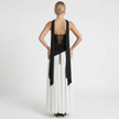 FJØRNA women's elegant strapless maxi dress shown from the back in black and white, flowing and stylish for formal occasions.