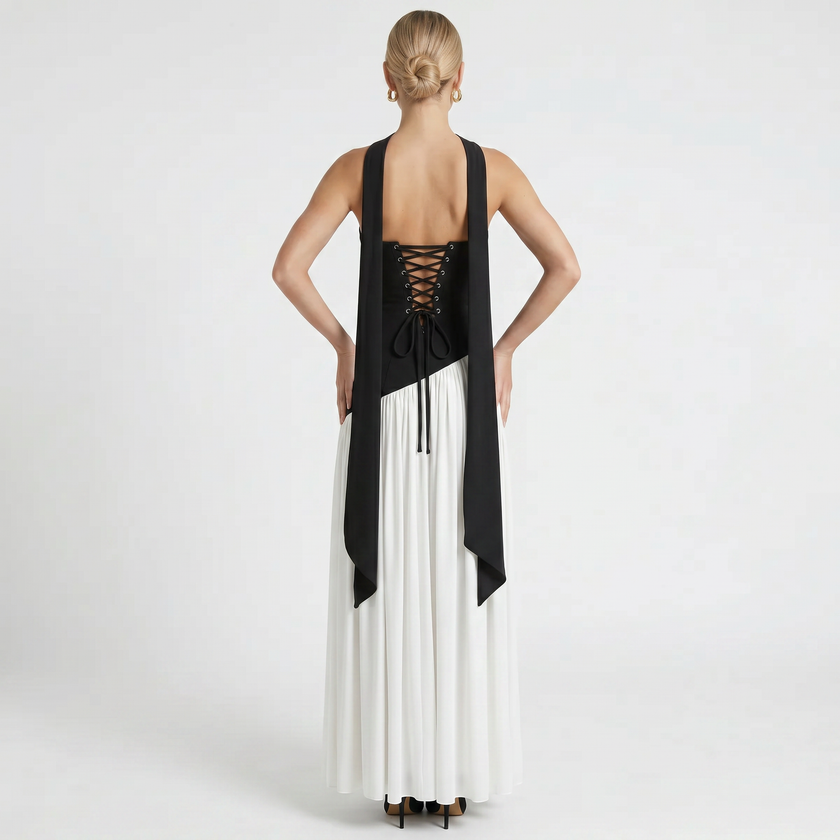 FJØRNA women's elegant strapless maxi dress shown from the back in black and white, flowing and stylish for formal occasions.