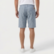 Back view of men's light blue linen shorts with elastic waistband and drawstring, designed for summer beachwear by FJØRNA.