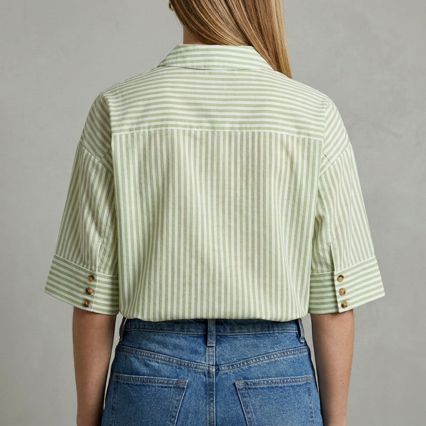 FJØRNA women's striped linen summer blouse shown from the back, lightweight and casual top for warm weather.