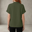 Back view of FJØRNA women's summer V-neck denim blouse with ruffle details, casual and stylish top for warm weather.