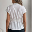 Back view of FJØRNA women's summer cap sleeve denim blouse, showcasing casual style and lightweight fabric.