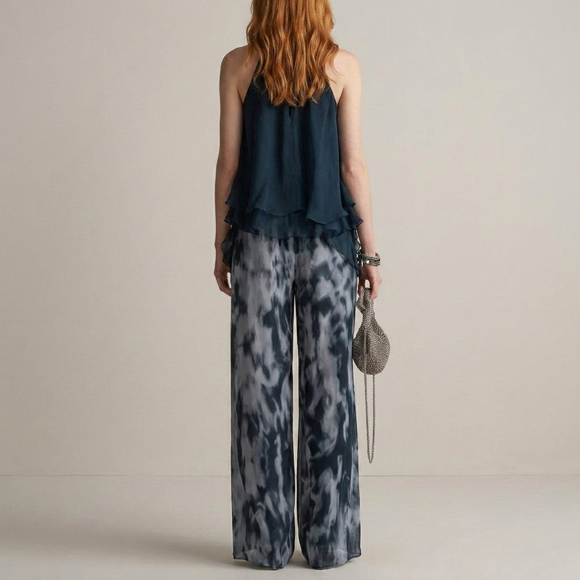 FJØRNA Midnight Mist halter blouse and flowing pants 2-piece set shown from the back, featuring a stylish halter design and relaxed fit.