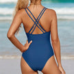 FJØRNA women's summer one-piece swimsuit with V-neck and ruched design, shown from the back in a stylish swimwear image.