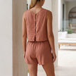 FJØRNA relaxed textured pleated two-piece set with button-front tank top and matching shorts, shown from the back.