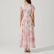 FJØRNA women's elegant mini dress with V-neck and flutter sleeves, shown from the back in a stylish, fitted design.