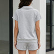 FJØRNA relaxed collared lounge set with drawstring shorts, back view showing soft fabric and casual fit in a cozy 2-piece design.