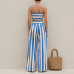 FJØRNA ruched strapless bandeau two-piece pantsuit with wide-leg pants and self-tie waist, shown from the back.