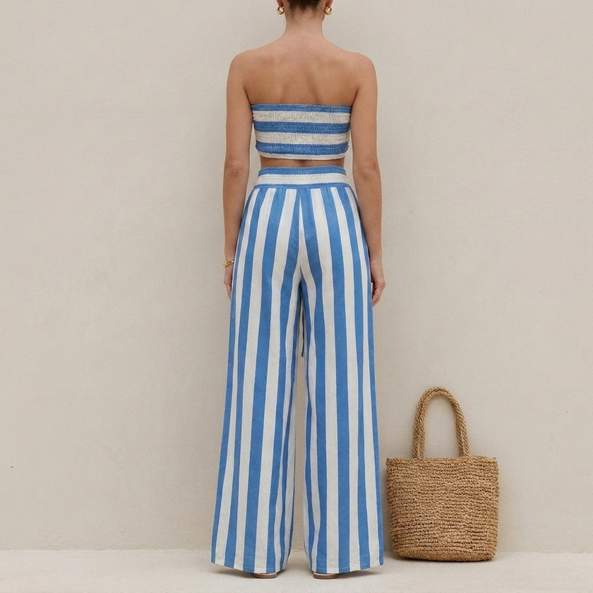 FJØRNA ruched strapless bandeau two-piece pantsuit with wide-leg pants and self-tie waist, shown from the back.
