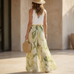 FJØRNA seaside halter top and flowing palazzo pants resort set, back view showing lightweight fabric and stylish design.