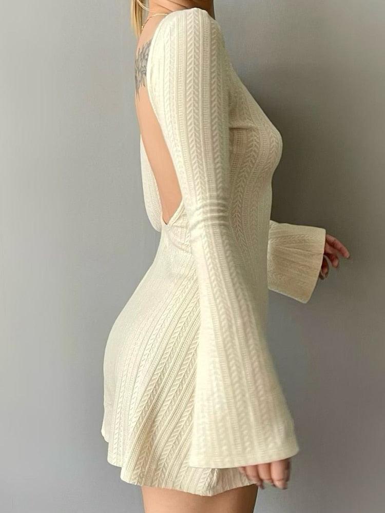 White backless mini dress by FJØRNA, stylish sleeveless dress with a fitted silhouette, perfect for summer or evening wear.